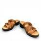 Clarks Merliah Karli tan leather sandal with a mid-height heel, riptape straps, and comfort footbed.
front view.