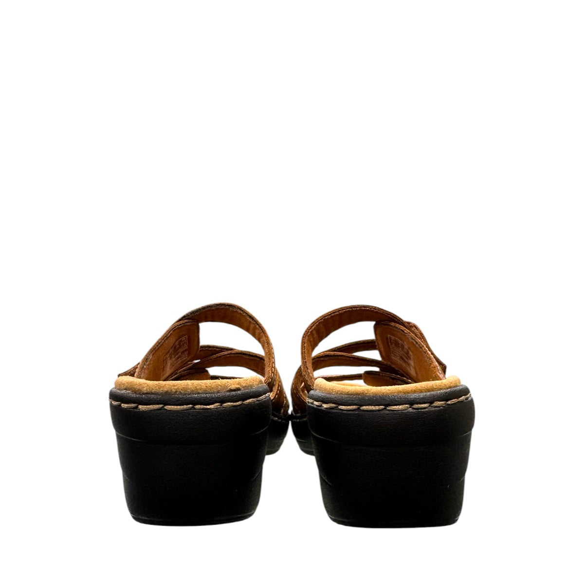 Clarks Merliah Karli tan leather sandal with a mid-height heel, riptape straps, and comfort footbed.
back view.