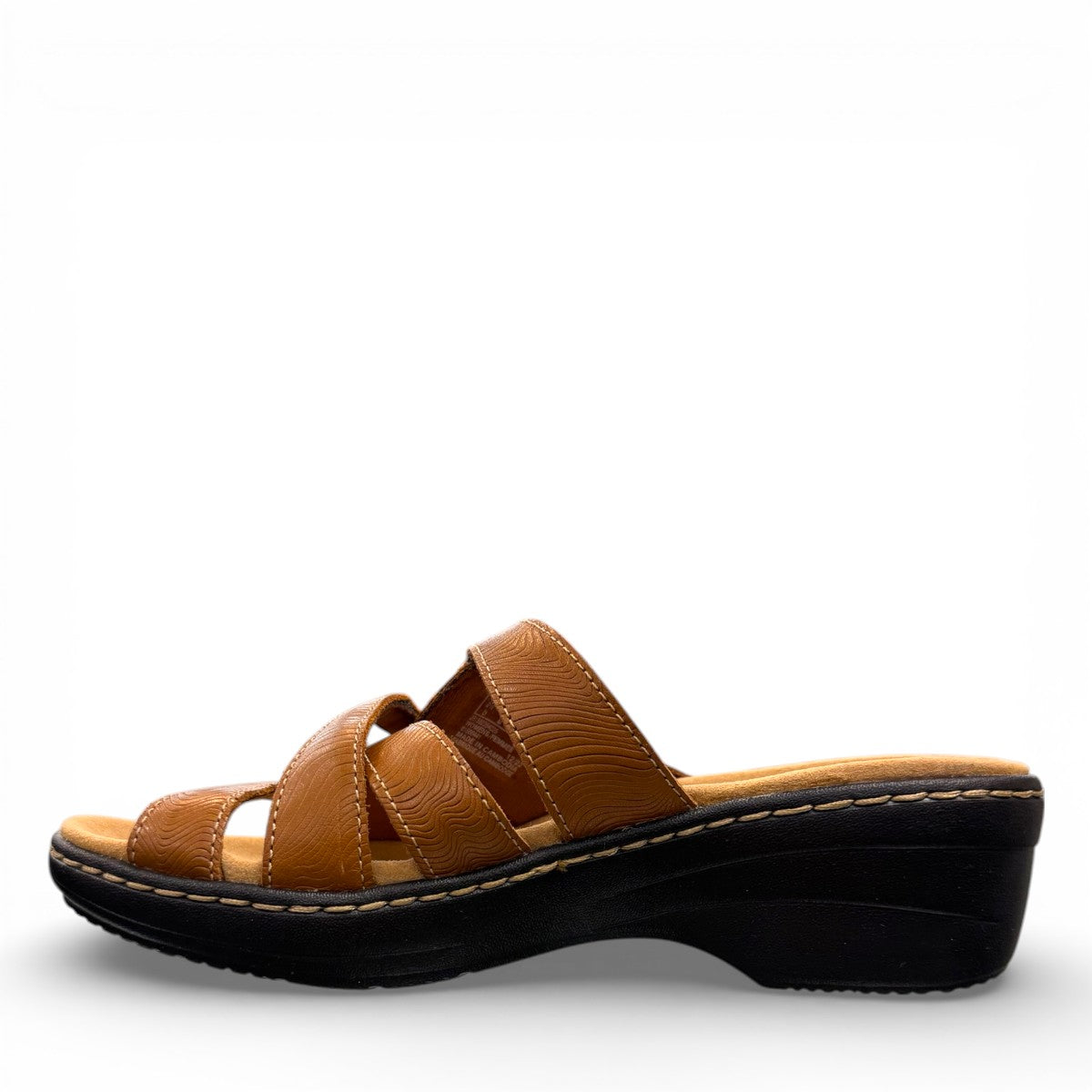 Clarks Merliah Karli tan leather sandal with a mid-height heel, riptape straps, and comfort footbed.
left right.