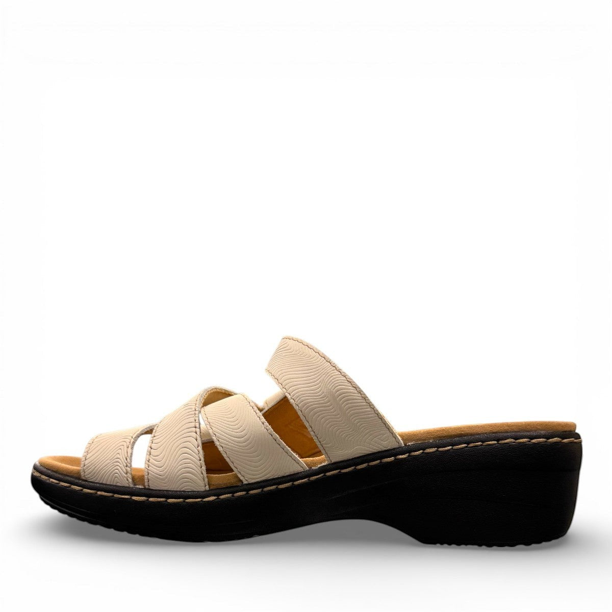 Clarks Merliah Karli white leather sandal with adjustable riptape straps and a comfortable mid-height heel. left view.