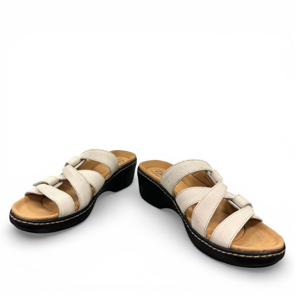 Clarks Merliah Karli white leather sandal with adjustable riptape straps and a comfortable mid-height heel. front view.