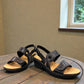 Clarks Merliah Opal black leather wedge sandals with adjustable straps and perforated detailing. front view.