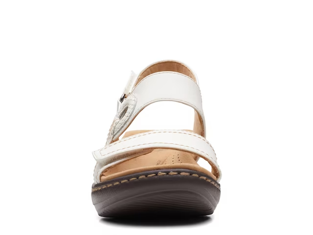 Clarks Merliah Opal white leather wedge sandals with adjustable straps and cushioned insole. front view.