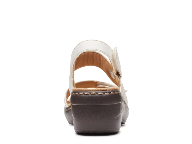Clarks Merliah Opal white leather wedge sandals with adjustable straps and cushioned insole. back view.