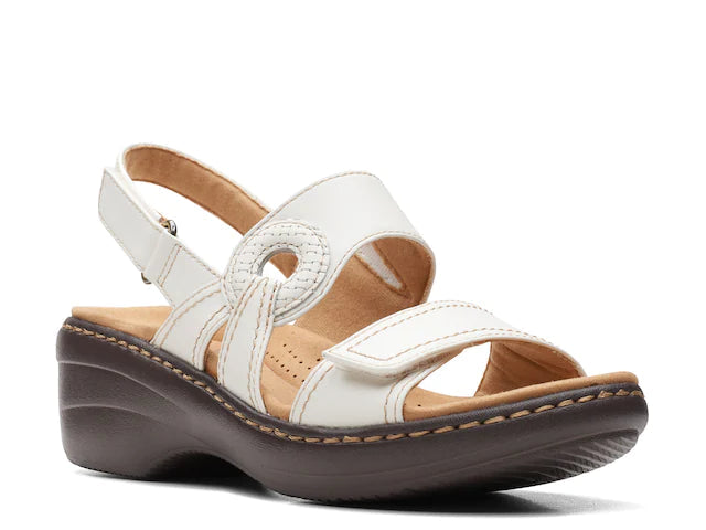 Clarks Merliah Opal white leather wedge sandals with adjustable straps and cushioned insole. front view.