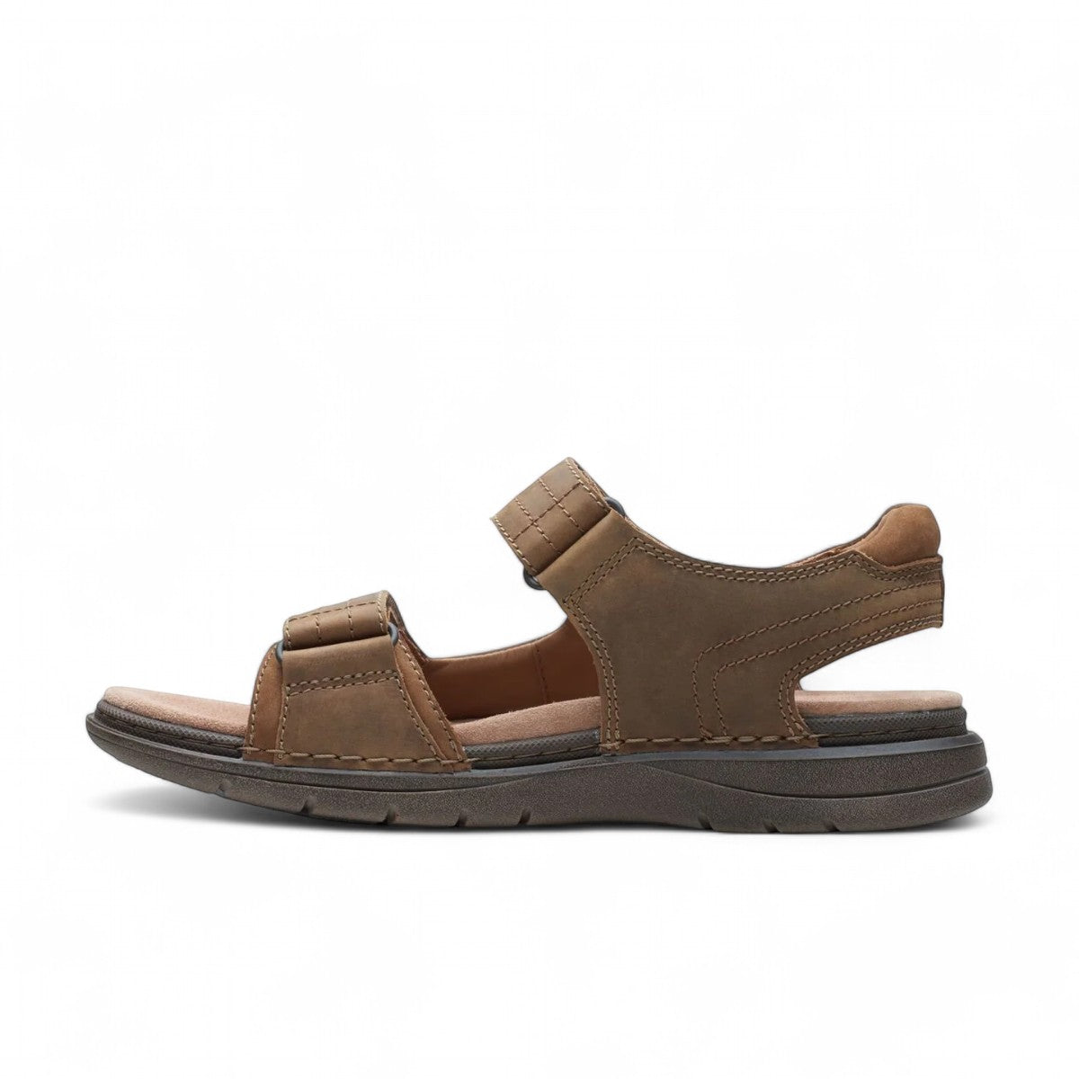 Clarks Nature Trek tan combi nubuck leather sandal with adjustable hook and loop straps.
photo of the left side.