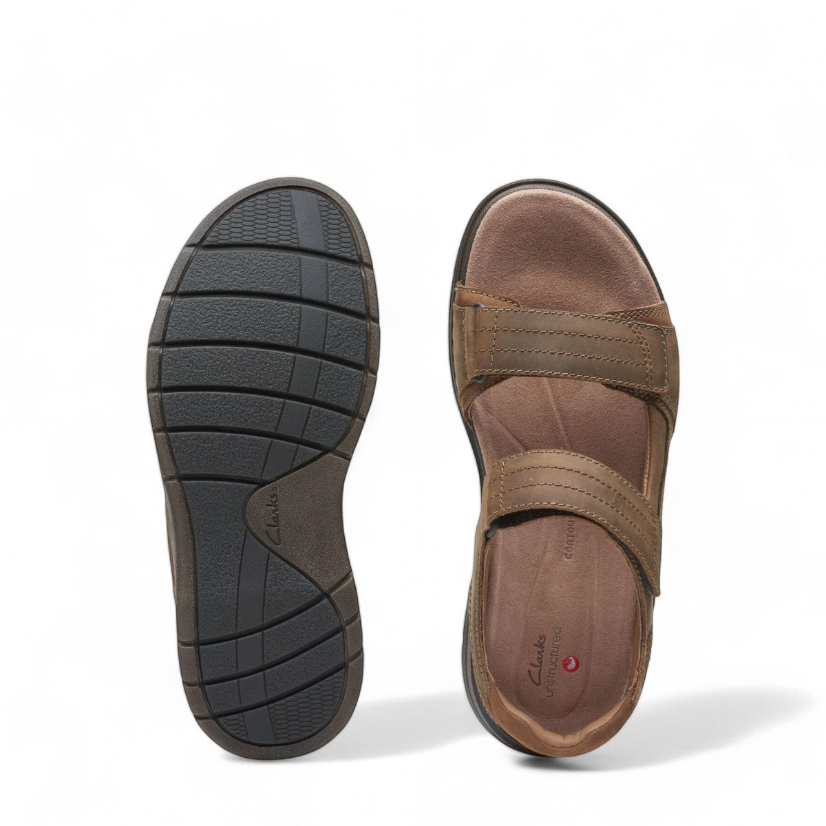 Clarks Nature Trek tan combi nubuck leather sandal with adjustable hook and loop straps.
photo of the bottom.