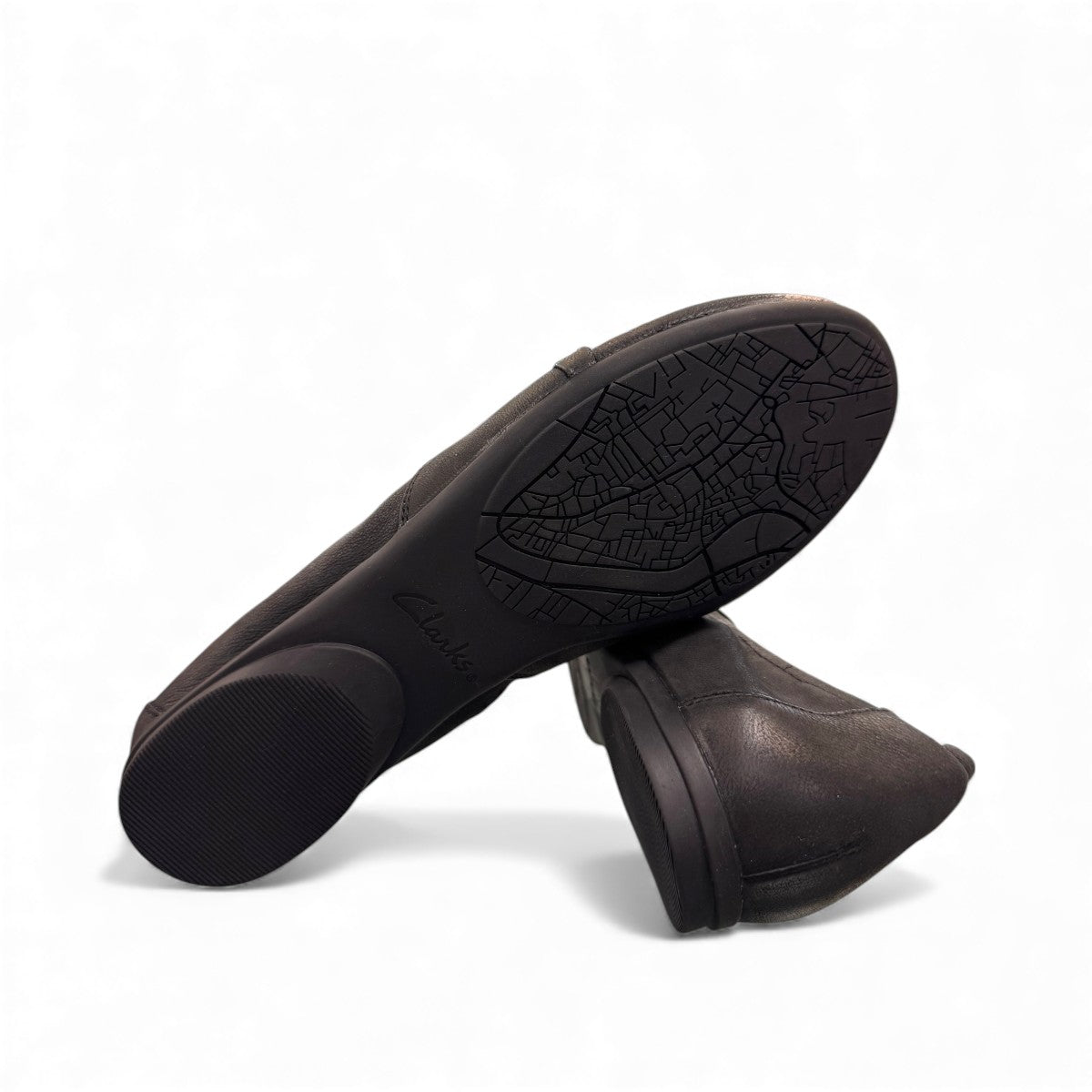 Clarks Rena Way black leather slip-on flat with elasticized topline and flexible rubber sole. bottom view.