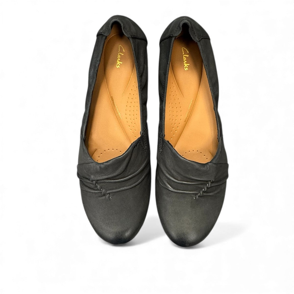 Clarks Rena Way black leather slip-on flat with elasticized topline and flexible rubber sole. top view.