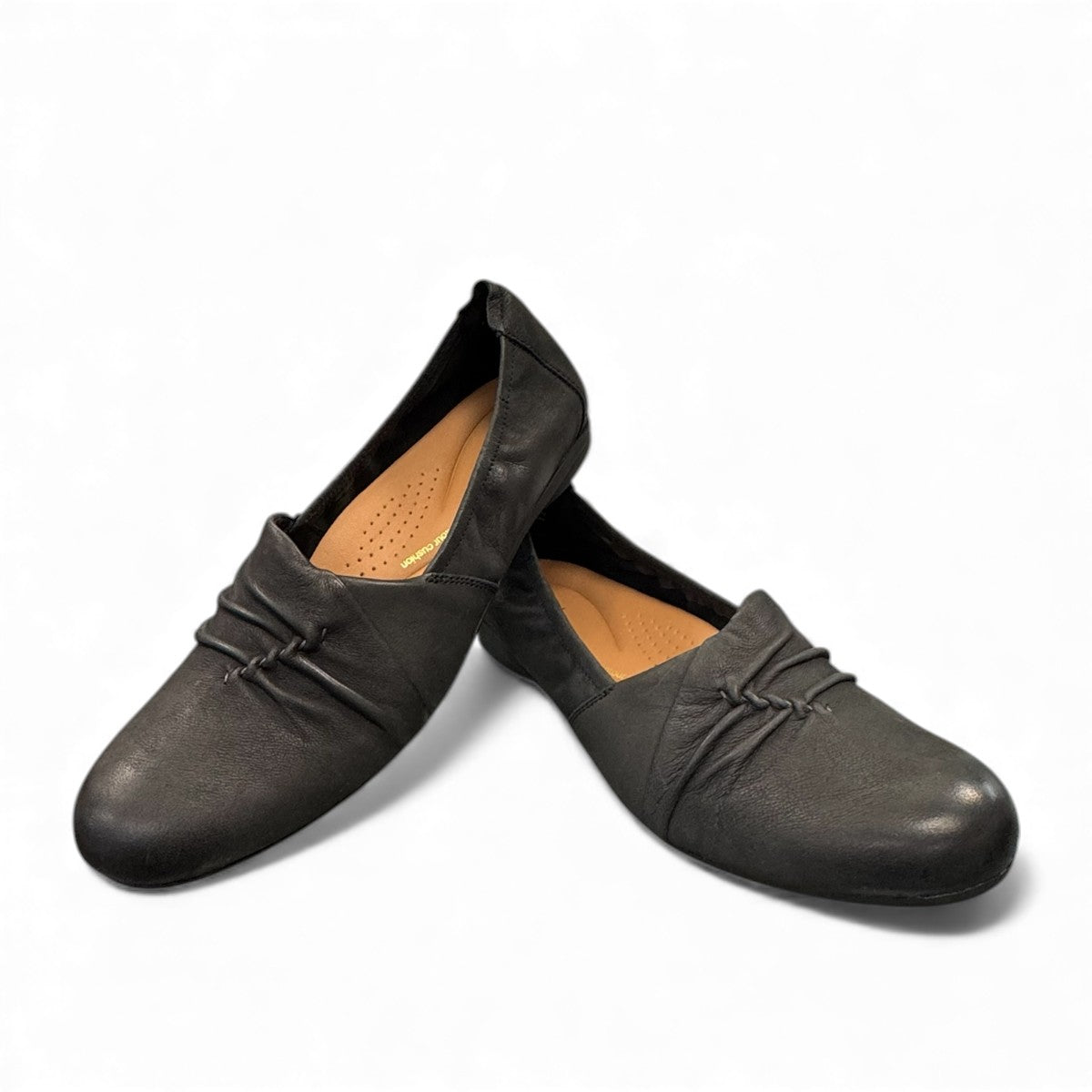 Clarks Rena Way black leather slip-on flat with elasticized topline and flexible rubber sole. front view.