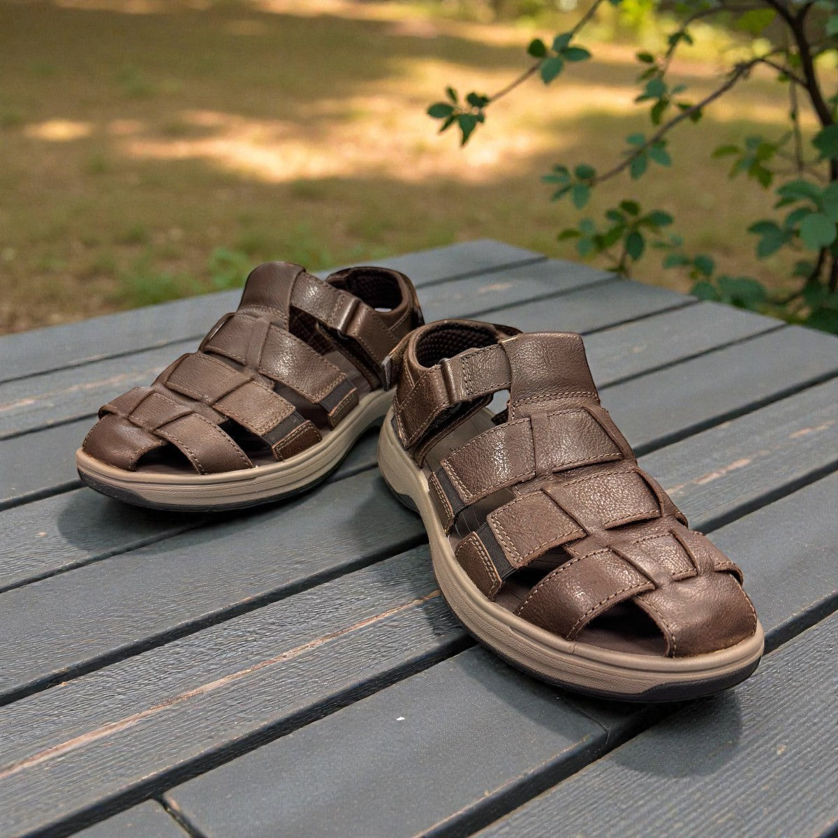 Clarks Saltway Cove fisherman sandal in dark brown leather with triple strap riptape closure. 
photo of the front.