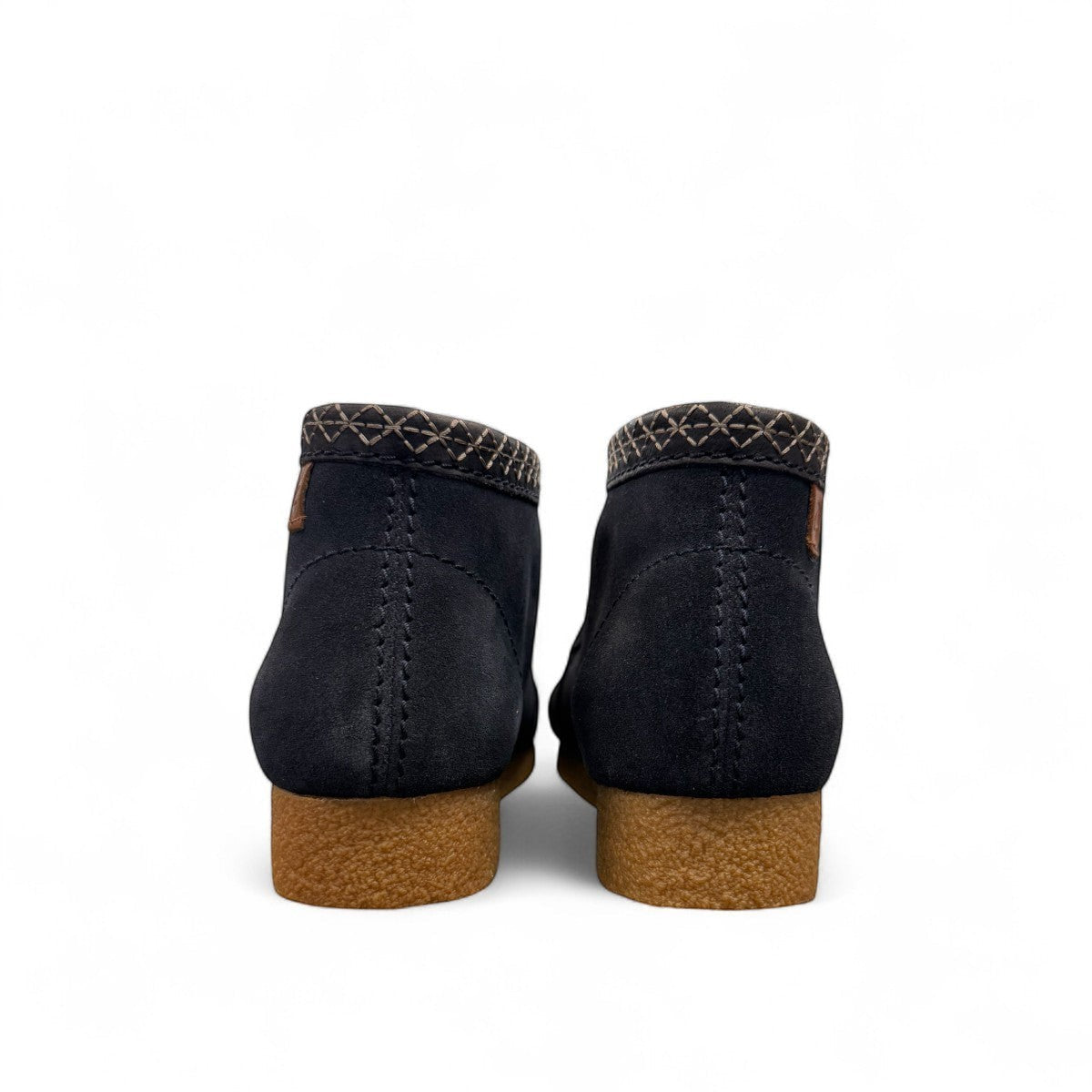 Sina Footwear Clarks Shacre blue leather boots, back view showing textured rubber soles and stitched collar detail. Photo of the back.