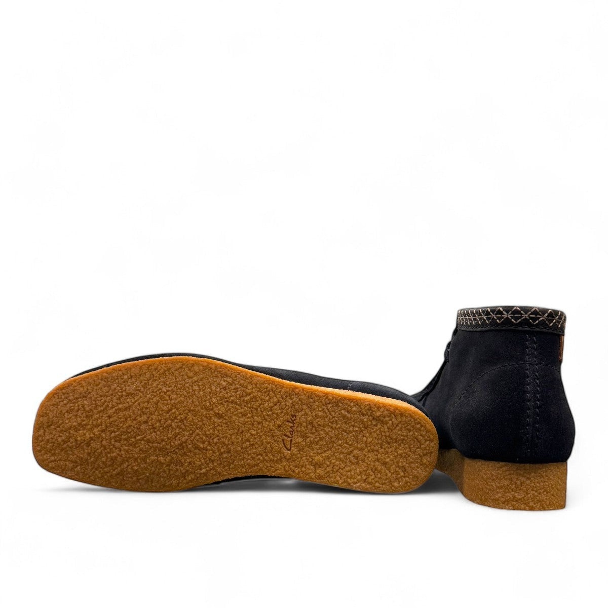 Sina Footwear Clarks Shacre blue leather boots showing the textured rubber sole and side profile. Photo of the bottom.