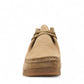 Clarks Shacre boots in dark sand suede with a classic Wallabee design, round toe, and rubber sole.
photo of the front.