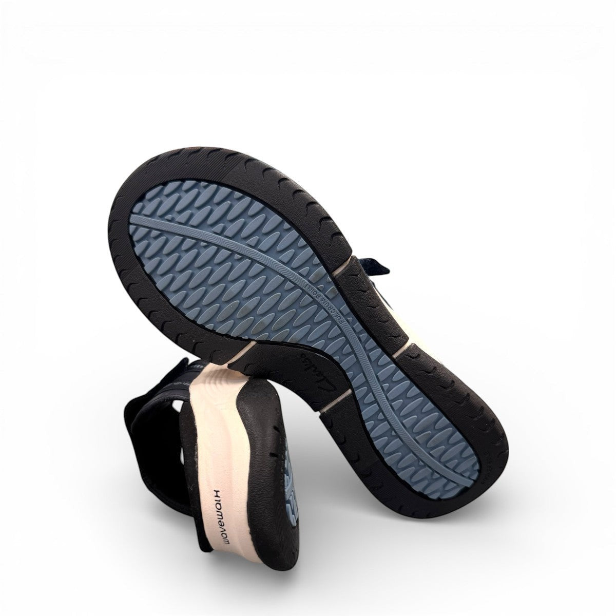 Clarks Wave 2.0 Sea navy nubuck thong sandal with curved WaveWalk sole and cushioned footbed. photo of the bottom.