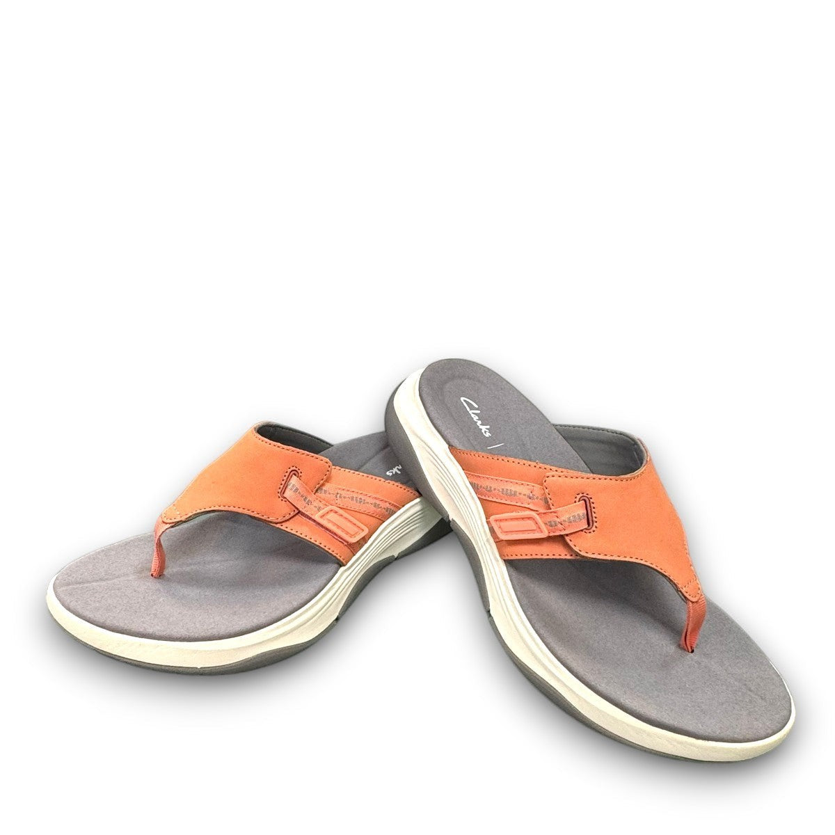Clarks Wave 2.0 Sea peach nubuck thong sandal with ergonomic WaveWalk sole and cushioned footbed.