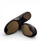 COBB HILL Paulette black leather slip-on shoe with asymmetrical ruching and antique metal button detail. Photo of bottom view.