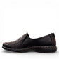 COBB HILL Paulette black leather slip-on shoe with asymmetrical ruching and antique metal button detail. Photo of left side view.