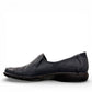 Cobb Hill Paulette navy leather slip-on shoe with asymmetrical lining and antique metal button detail. Photo of left side view.