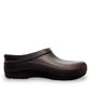 Dansko Kaci black molded EVA clogs showing the slip-resistant rubber outsole tread pattern. Photo of inside side view.