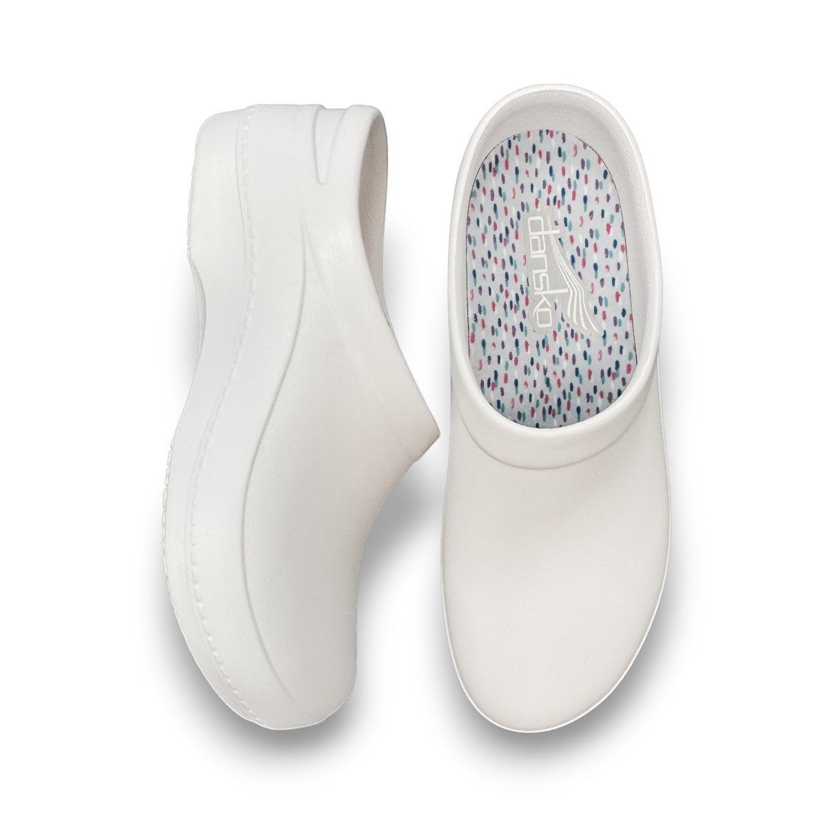 Dansko Kaci white molded EVA clogs showing the slip-resistant rubber outsole and arch support design. Photo of upper view.