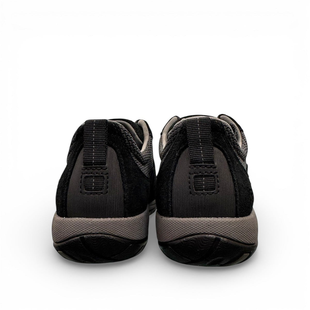 Dansko Paisley black waterproof suede outdoor shoes, slip resistant,  showing durable Vibram rubber outsoles. Photo of back view.