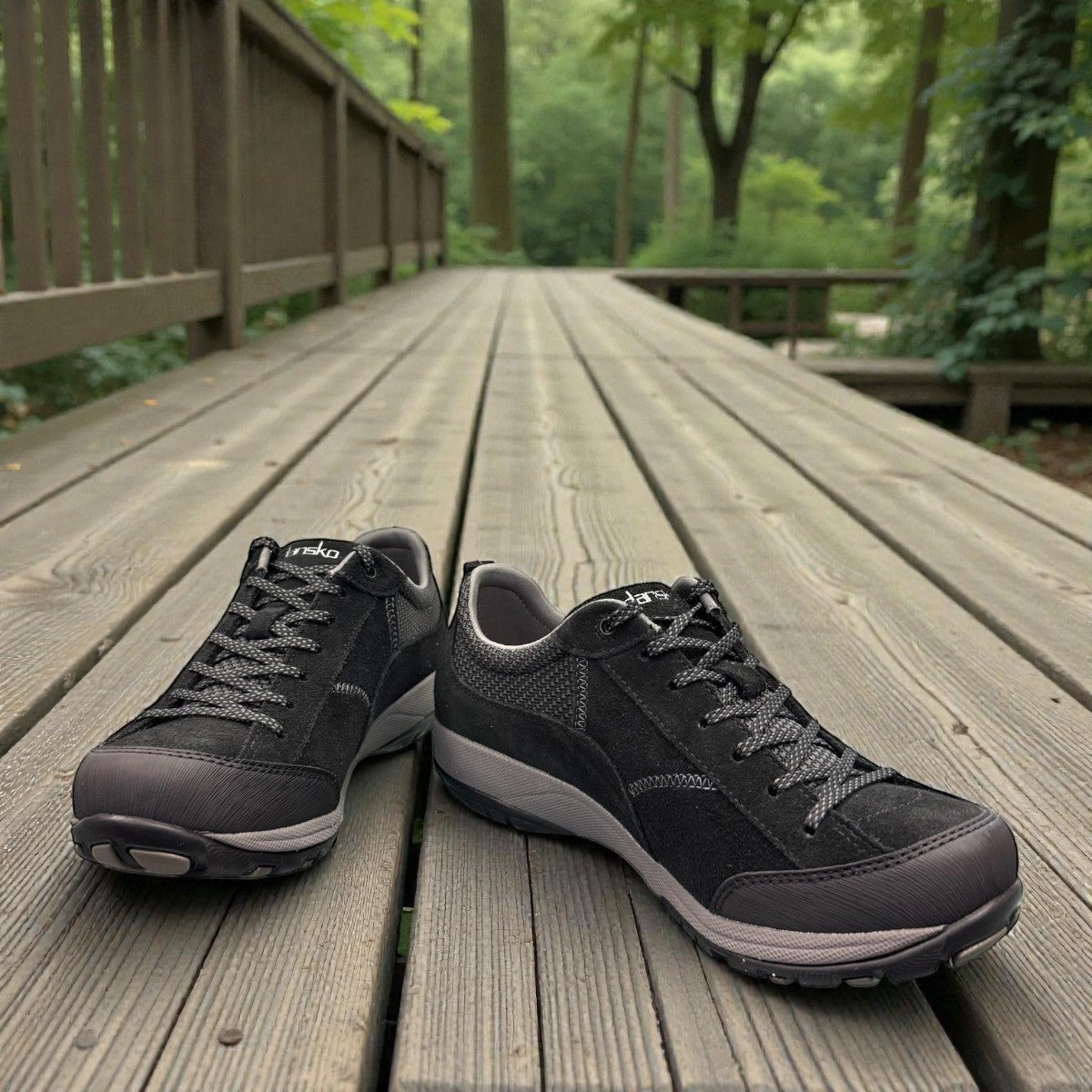 Dansko Paisley black waterproof suede outdoor shoes, slip resistant, showing durable Vibram rubber outsoles. Photo of front view.