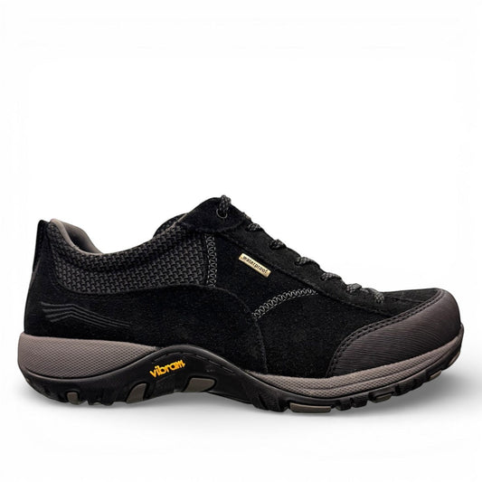 Dansko Paisley black waterproof suede outdoor shoes, slip resistant, showing durable Vibram rubber outsoles. Photo of inside side view.