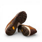 Dansko Paisley brown burnished suede outdoor shoes showing the slip-resistant Vibram rubber outsoles. Photo of bottom view.