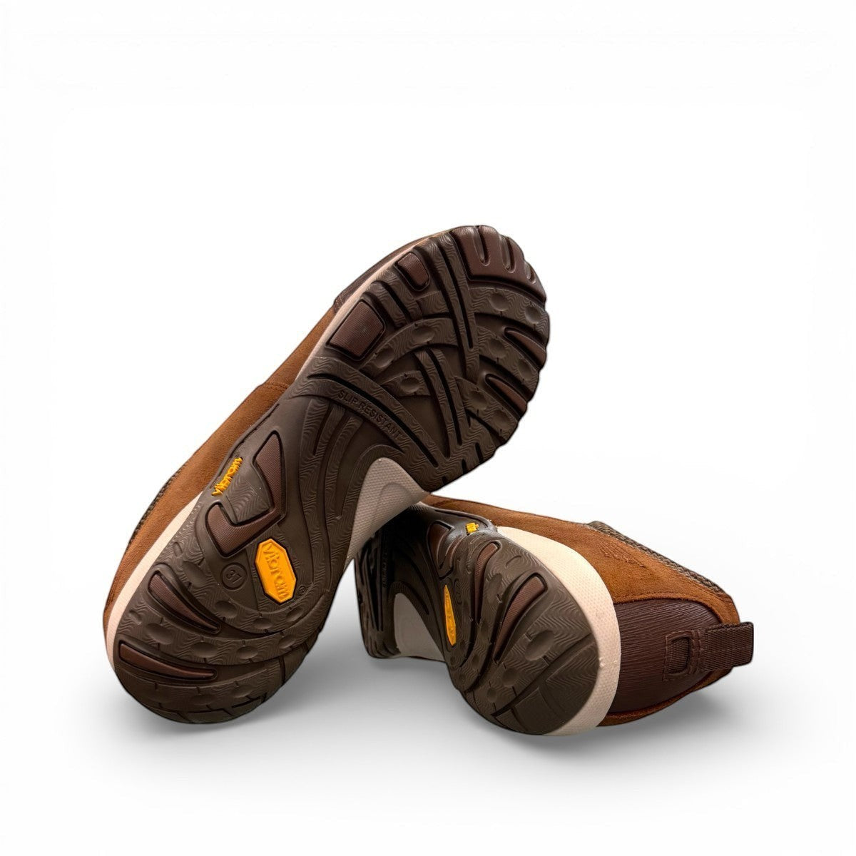 Dansko Paisley brown burnished suede outdoor shoes showing the slip-resistant Vibram rubber outsoles. Photo of bottom view.