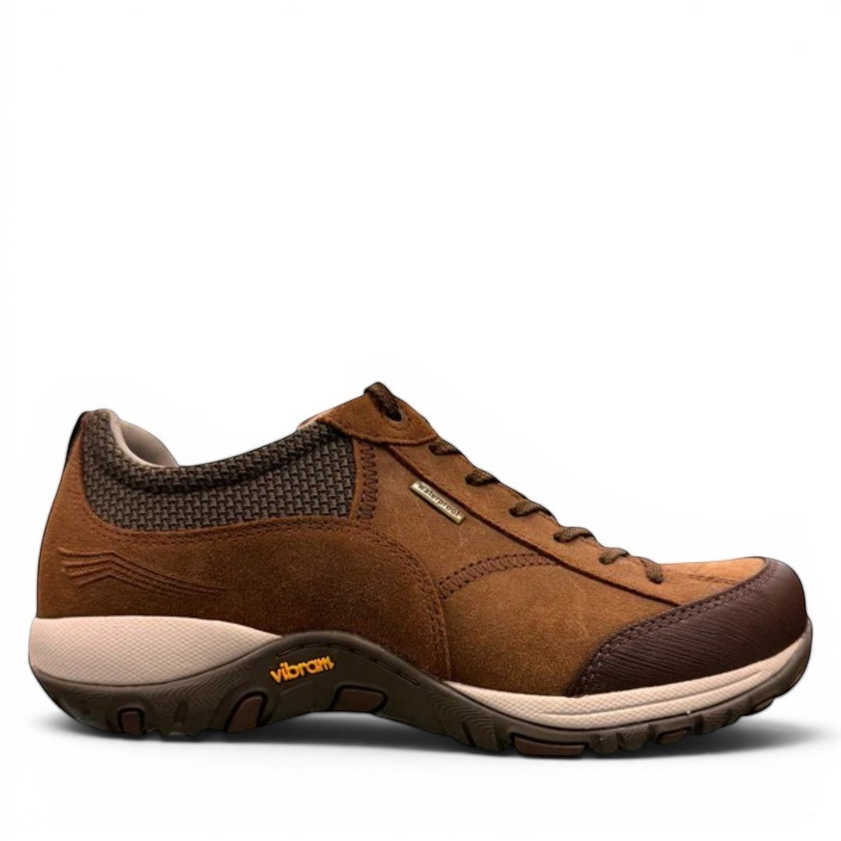 Dansko Paisley brown burnished suede outdoor shoes showing the slip-resistant Vibram rubber outsoles. Photo of side view.