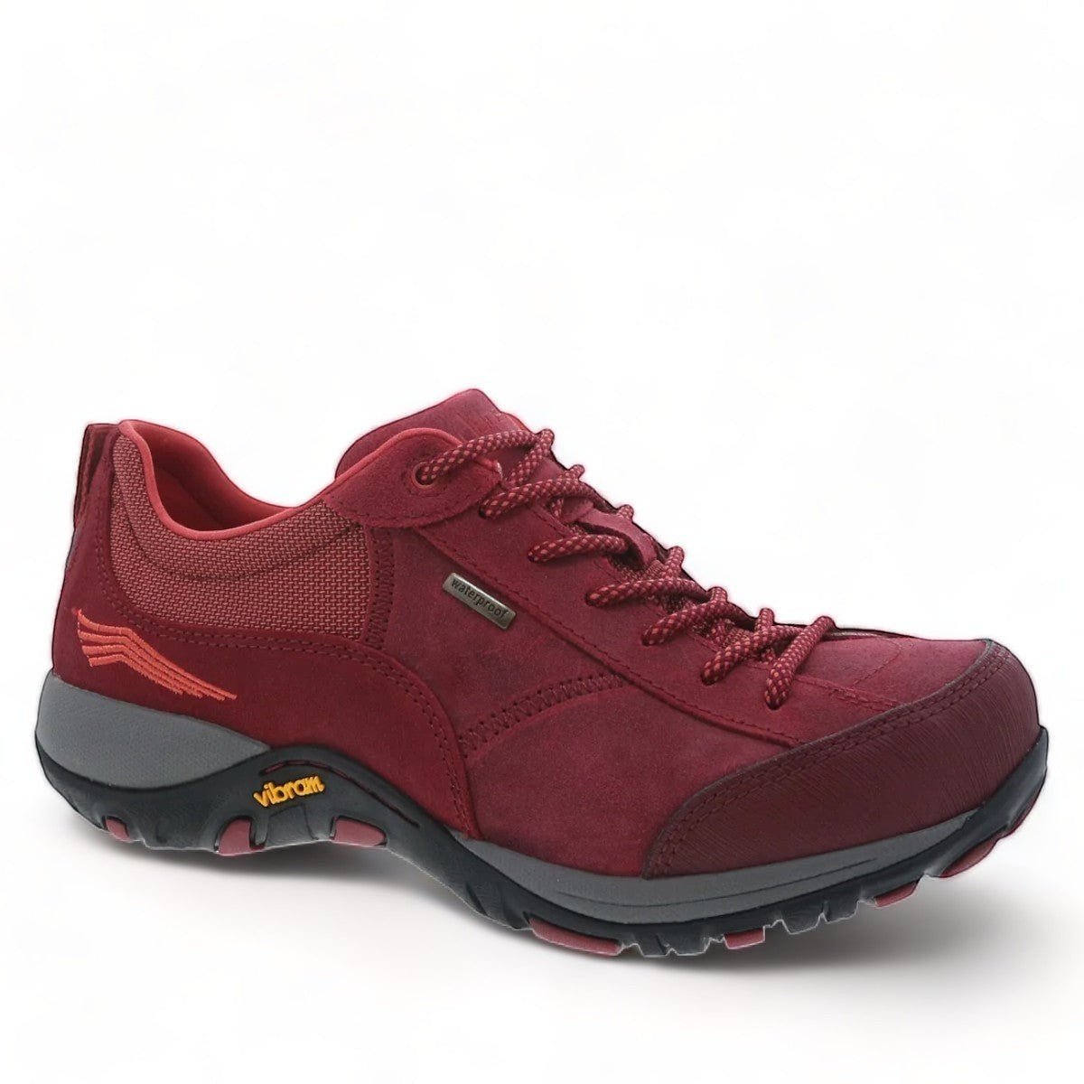 Dansko Paisley red burnished suede outdoor shoe showing the durable slip-resistant Vibram rubber outsole. Photo of side view at an angle.