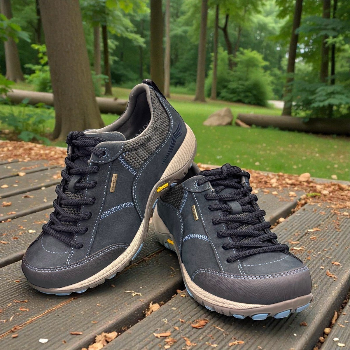 Dansko Paisley navy milled suede outdoor shoes showing the durable slip-resistant Vibram rubber outsoles. Photo of the front.