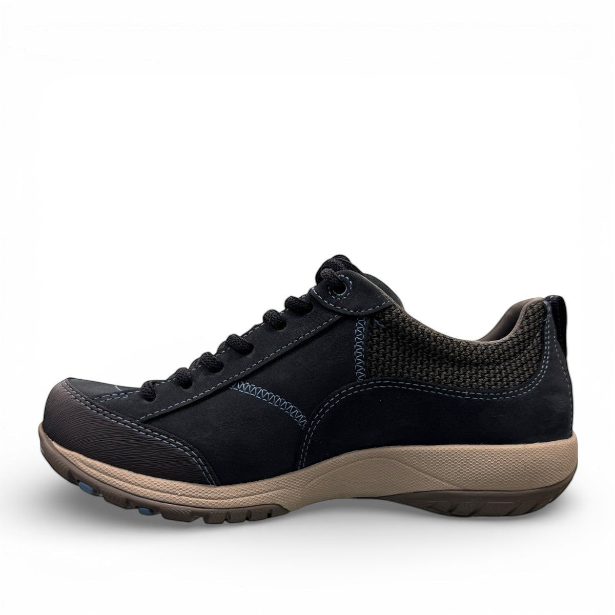 Dansko Paisley navy milled suede outdoor shoes showing the durable slip-resistant Vibram rubber outsoles. Photo of left sideview.