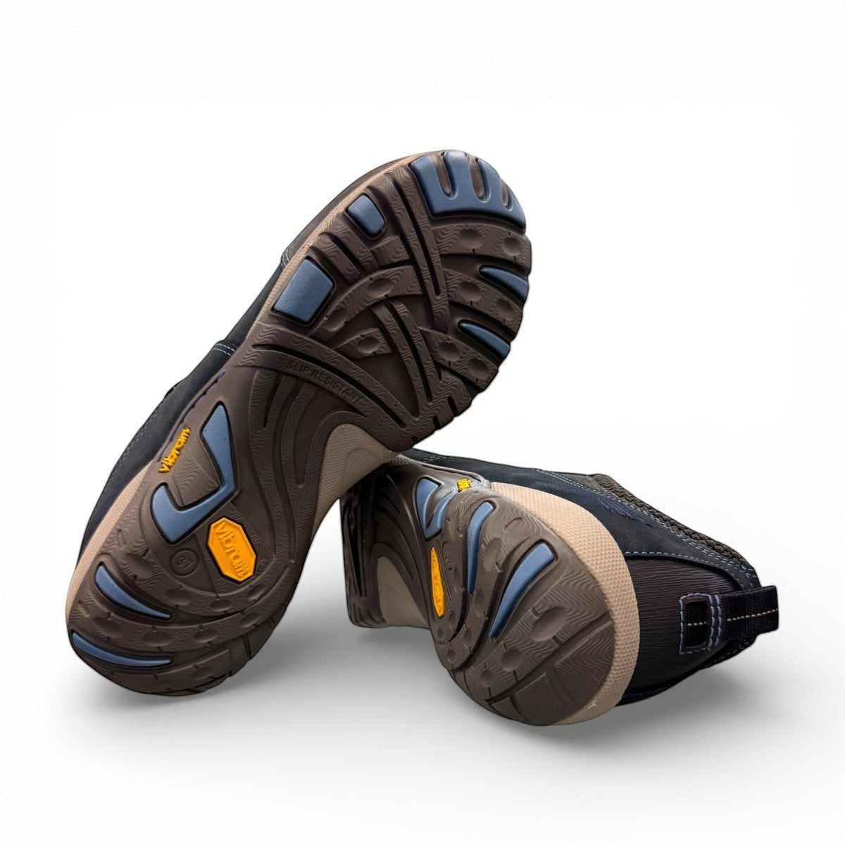 Dansko Paisley navy milled suede outdoor shoes showing the durable slip-resistant Vibram rubber outsoles. Photo of the bottom view.