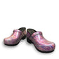 Dansko XP 2.0 patent leather clogs in pastel blur print with slip-resistant soles for occupational use. Photo of front view.
