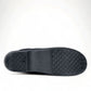 Dansko Pro XP black leather slip-resistant professional clog with rocker bottom and padded collar. Photo of bottom view.