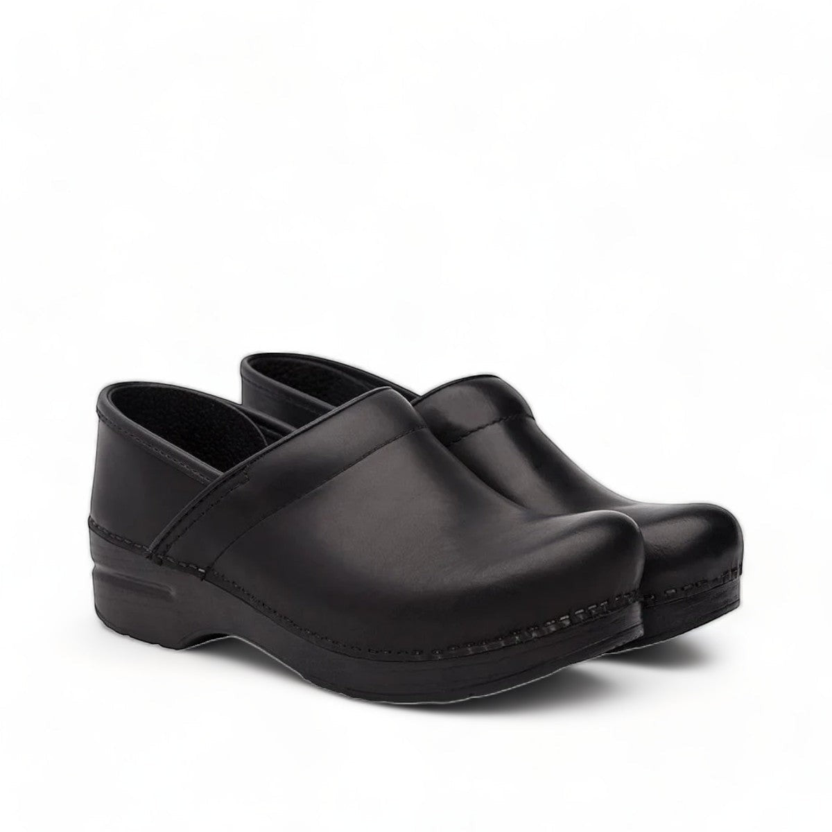 Dansko Pro XP black leather slip-resistant professional clog with rocker bottom and padded collar. Photo of side view.
