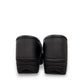 Dansko XP 2.0 black waterproof leather performance clog showing the slip-resistant rubber outsole. Photo of back view.