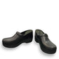 Dansko XP 2.0 black waterproof leather performance clog showing the slip-resistant rubber outsole. Photo of front view at an angle.