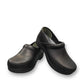 Dansko XP 2.0 black waterproof leather performance clog showing the slip-resistant rubber outsole. Photo of front view.