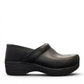 Dansko XP 2.0 black waterproof leather performance clog showing the slip-resistant rubber outsole. Photo of right side view.