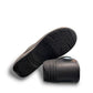 Dansko XP 2.0 black waterproof leather performance clog showing the slip-resistant rubber outsole