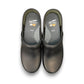 Dansko XP 2.0 black waterproof leather performance clog showing the slip-resistant rubber outsole. Photo of upper view.