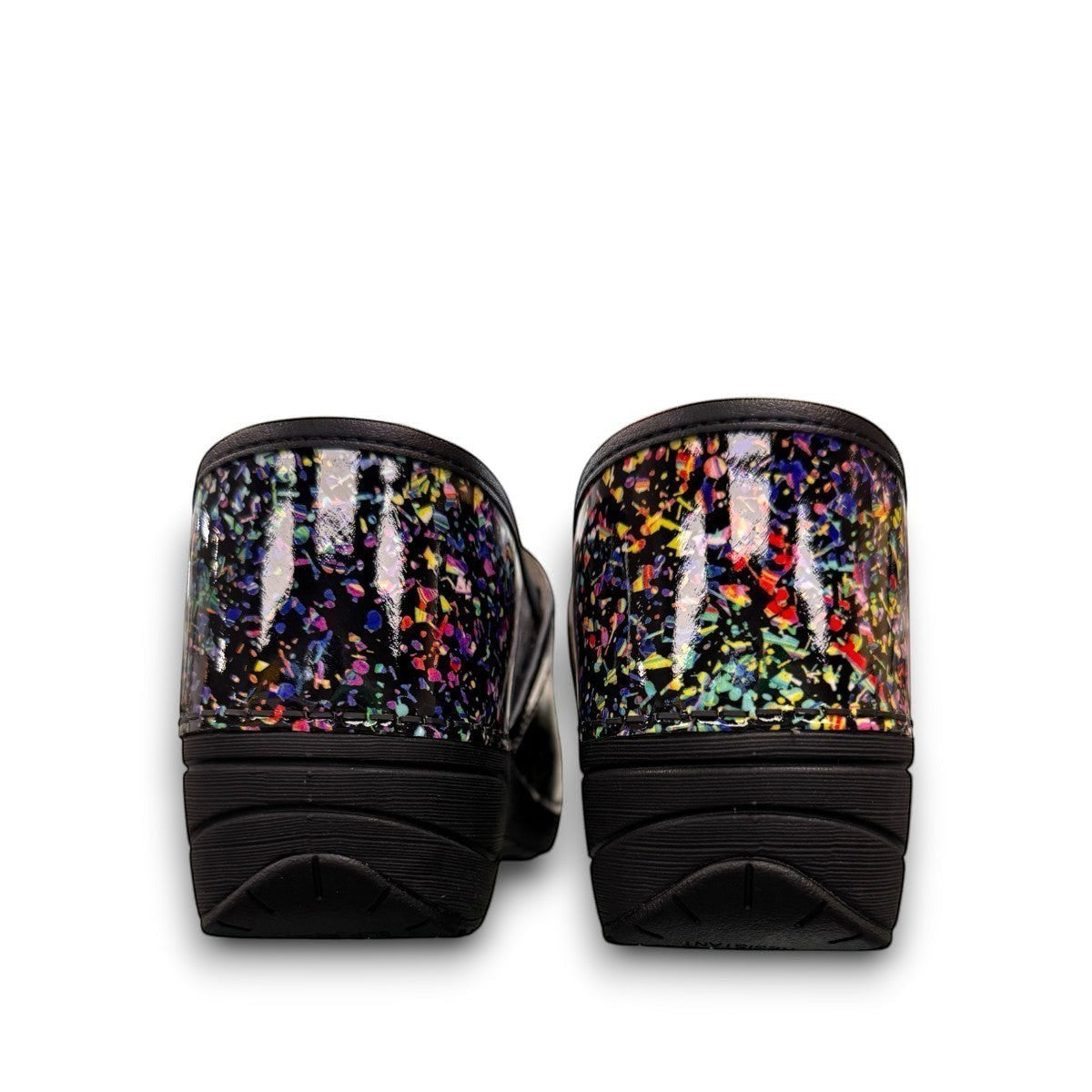Dansko XP 2.0 patent clog in black with a colorful confetti-like pattern and slip-resistant sole.