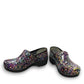 Dansko XP 2.0 patent clog in black with a colorful confetti-like pattern and slip-resistant sole.