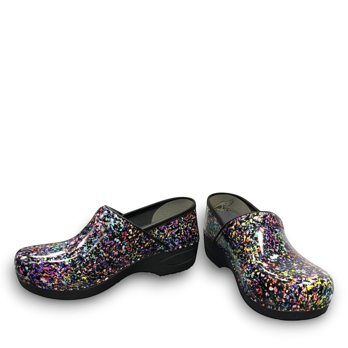 Dansko XP 2.0 patent clog in black with a colorful confetti-like pattern and slip-resistant sole.