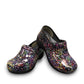 Dansko XP 2.0 patent clog in black with a colorful confetti-like pattern and slip-resistant sole.