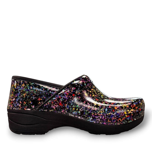 Dansko XP 2.0 patent clog in black with a colorful confetti-like pattern and slip-resistant sole.