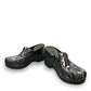 Dansko XP 2.0 patent clog showing the black slip-resistant rubber outsole and glitter wave pattern.